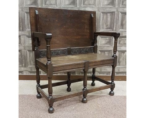 OAK MONKS BENCH, of small proportions, with folding top, on turned baluster legs joined by a straight stretcher, 86cm wide