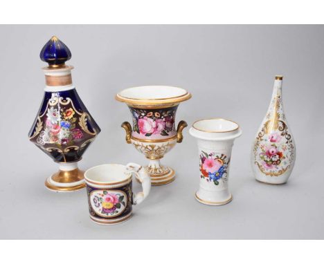 A group of early 19th century English porcelainpainted with flowers, including an unusual cobalt and gilt mug with a handle i