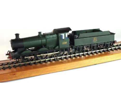 An O-gauge scratch-built model steam locomotive, '2236', 0-6-0, in plain green livery, with a tender with a British Railways 