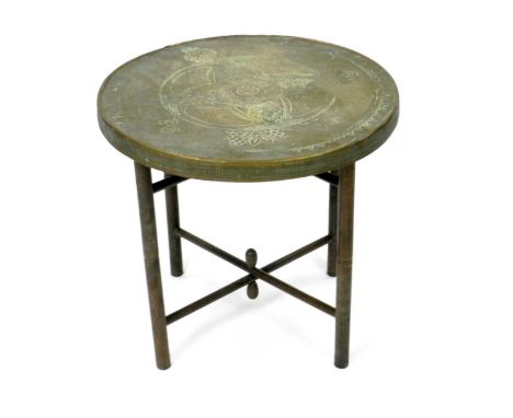 A folding brass and wood occasional table, first quarter 20th century, the separate brass bound circular top incised with vig