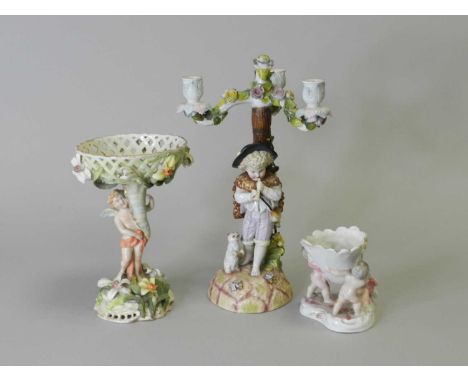 A Schierholz &amp; Son Plaue figural sweetmeat basket, impressed number 727, painted mark in blue, (at fault), 23.5cm high; t