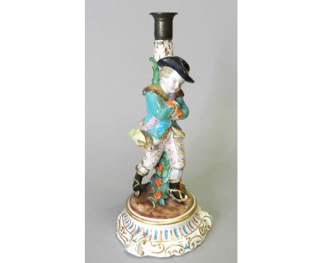 A Fontainebleau (Jacob Petit) porcelain figural candlestick, circa 1862-1874, with a young gallant male dressed in brightly c