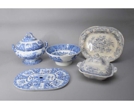 A collection of 19th century blue and white pottery, including a drainer printed with a basket of flowers, 38cm; a meat platt