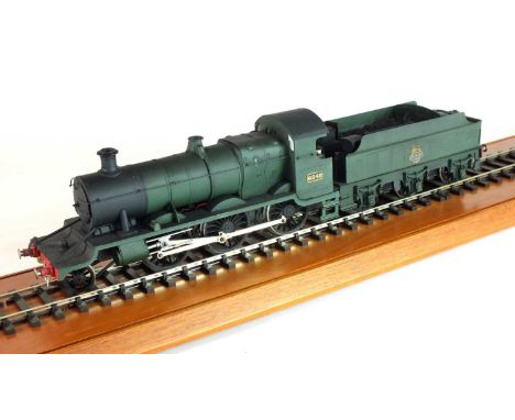 An O-gauge scratch-built model steam locomotive, '6342', 2-6-0, in GWR green livery, with a tender with a British railways lo