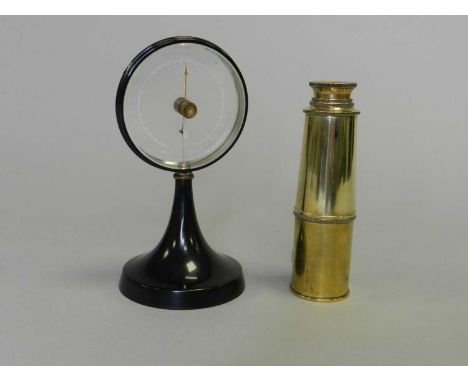 A Goerz-Werk, Berlin, 'mystery' barometer in black anodized casing, 16.5cm high, together with a brass three-draw pocket tele