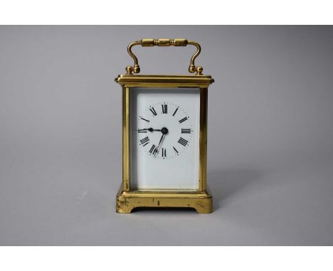 A French gilt brass carriage timepiece, first half 20th century, of typical form with swing carry handle, the movement with p