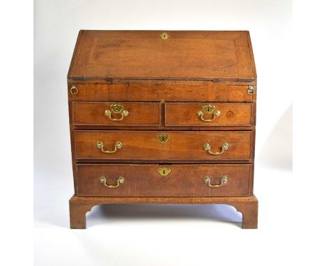 A George II / George III oak bureau, with a stepped interior and a well, very damaged and losses, 96cm wide x 53cm deep x 101