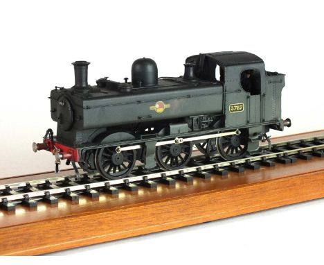 An O-gauge scratch-built model steam locomotive, '3767', 0-6-0, in black livery, with British Railways logo of a lion rampant