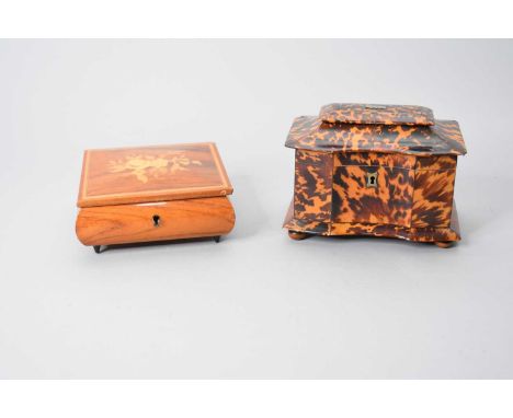 A 19th century tortoiseshell tea caddy, of serpentine casket form, 18cm wide (distressed), together with a walnut marquetry j