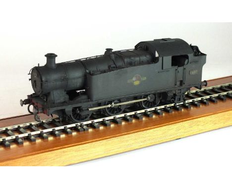 An O-gauge, scratch-built model of a BR steam locomotive, '6697', 0-6-2, in 'weathered' black livery, with a British Railways