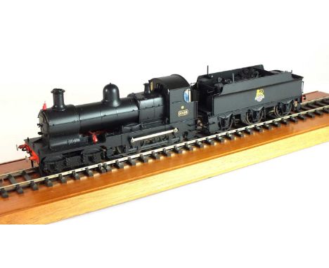 An O-gauge, scratch-built model of a BR steam locomotive, '9026', 4-4-0, in black livery, with a British Railways logo of a l