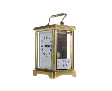 EARLY 20TH CENTURY CARRIAGE CLOCK, with white enamel dial with Roman numerals, the brass five glass case, the top inscribed i