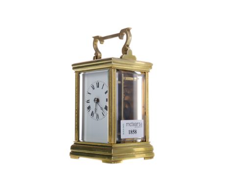 EARLY 20TH CENTURY CARRIAGE CLOCK, with white enamel dial with Roman numerals, the brass five glass case with swing handle, o