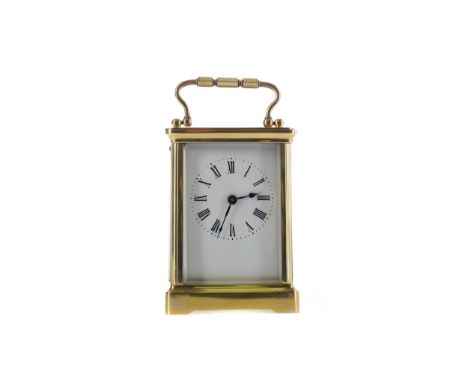 EARLY 20TH CENTURY CARRIAGE CLOCK, with white enamel dial with Roman numerals, the brass five glass case with swing handle, o