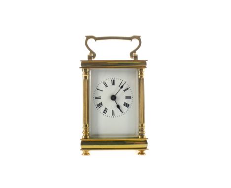 EARLY 20TH CENTURY CARRIAGE CLOCK, with white enamel dial with Roman numerals, the pillared brass five glass case with swing 