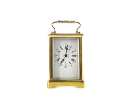 EARLY 20TH CENTURY CARRIAGE CLOCK, with white enamel dial with Roman and Arabic numerals, the brass five glass case with swin