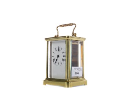 EARLY 20TH CENTURY CARRIAGE CLOCK, with white enamel dial with Roman numerals, the brass five glass case with swing handle, o