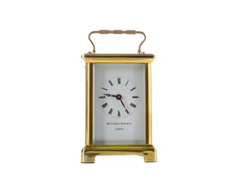 MID-20TH CENTURY CARRIAGE CLOCK, By Matthew Norman, with white enamel dial with Roman numerals and makers name, the brass fou