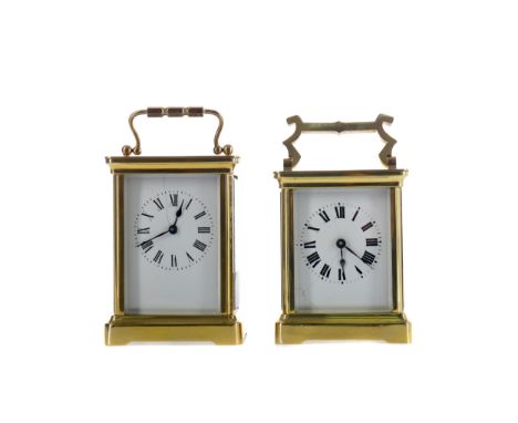 EARLY 20TH CENTURY CARRIAGE CLOCK, with white enamel dial with Roman numerals, the brass five glass case with swing handle, o