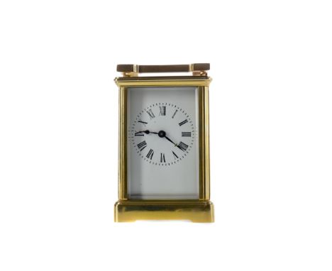 EARLY 20TH CENTURY CARRIAGE CLOCK, with white enamel dial with Roman numerals, the brass five glass case with swing handle, o