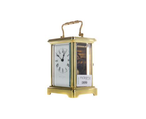 EARLY 20TH CENTURY CARRIAGE CLOCK, with white enamel dial with Roman numerals and faded inscription, the brass five glass cas