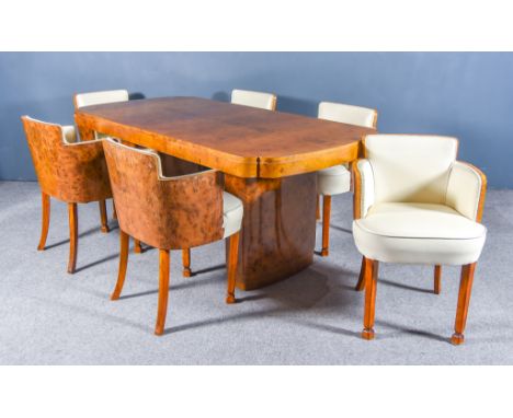 A 1930s Figured Walnut Rectangular Dining Table of "Art Deco" Design, with re-entrant corners, the top with matched veneered 