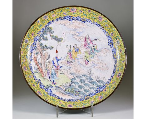 A Chinese Canton Enamel Dish, 18th Century Qianlong, enamelled in colours with the eight Daoist immortals, 16ins (40.6cm) dia
