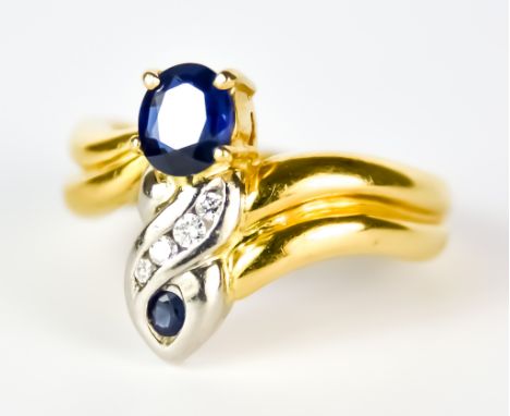 A Sapphire and Diamond Ring, Modern, 18ct gold, set with a sapphire, approximately .50ct, a smaller sapphire, approximately .