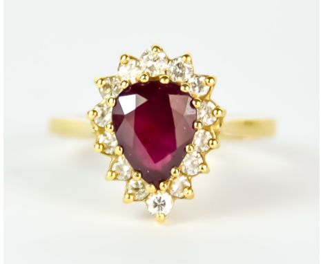 A Ruby and Diamond Ring, Modern, 18ct yellow gold, set with a centre pear shaped ruby, approximately .75ct, surrounded by bri