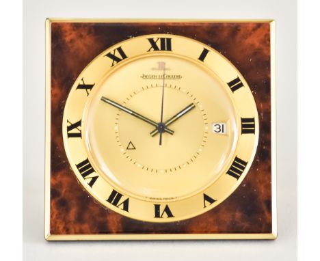 An Automatic Travel Calendar Alarm Clock by Jaeger-LeCoultre, Serial No. 1291409, 45mm x 45mm, gold dial with luminous hands 