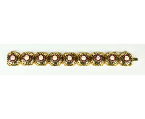 An 18ct Gold Ruby and Pearl Bracelet, 20th Century, set with cultured pearls, each pearl surrounded by small ruby stones form