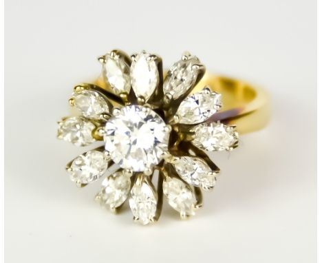 A Diamond Flower Head Ring, 20th Century, centre brilliant cut white diamond, approximately .75ct, surrounded by twelve marqu