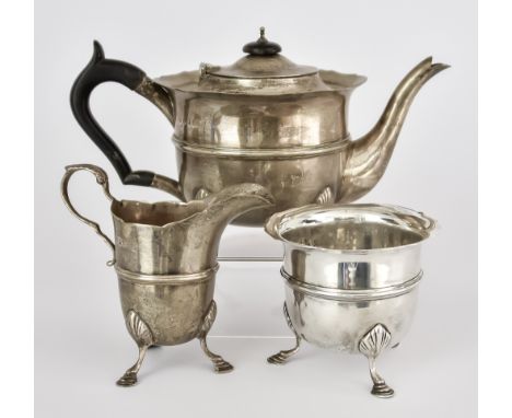 An Edward VII Irish Silver Circular Three Piece Tea Service, by Charles Lambe, Dublin 1909, with shaped rims and moulded gird