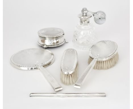 An Elizabeth II Silver Backed and Silver Mounted Six Piece Dressing Table Set, by W I Broadway &amp; Co., with engraved leaf 