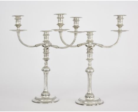 A Pair of Elizabeth II Silver Three Light Candelabra, by Garrard &amp; Co. Ltd, London, 1969, with gadroon and leaf mounts, r
