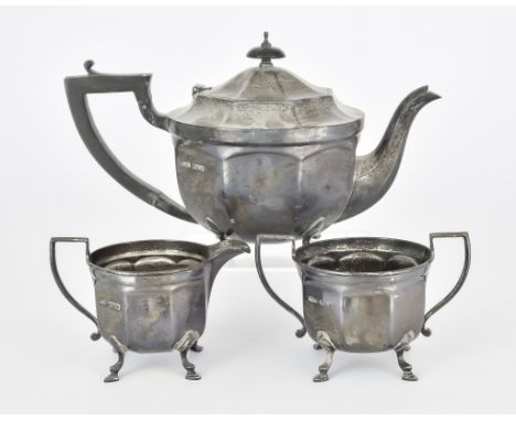 A George VI Silver Circular Three-Piece Tea Service, by E. Silver &amp; Co., Sheffield, 1949, of panelled form and on scroll 