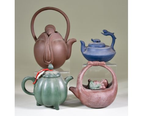 Four Chinese Yixing Stoneware Teapots and Covers, including green ribbed example on three feet, 4.75ins (12.1cm), and example
