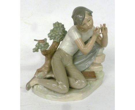LLADRO FIGURE, YOUNG MAN RECLINING ON GROUND PLAYING A FLUTE, 8" HIGH (SLIGHT FAULTS) 