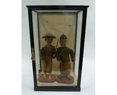 TWO EARLY TWENTIETH CENTURY CHINESE COMPOSITION DRESSED MALE FIGURES, one of a fisherman with rod and fish, the other of an o