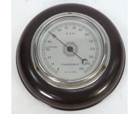 G & C, EARLY TWENTIETH CENTURY BROWN BAKELITE CASE ANEROID WALL BAROMETER, 7" (17.8cm) diameter 
