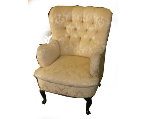 VICTORIAN STYLE BUTTON UPHOLSTERED FIRESIDE ARMCHAIR ON A CABRIOLE SUPPORTS AND A FOOTSTOOL