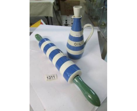 A T G Green Cornish ware rolling pin and oil bottle