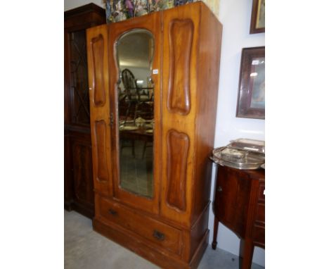 An art nouveau wardrobe, missing cornice