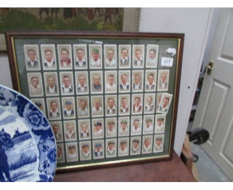 A framed and glazed set of Player's cricketer cigarette cards