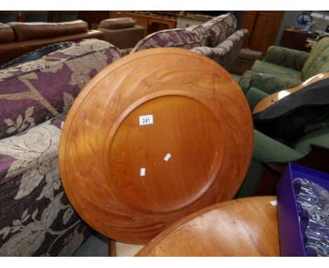 A very large (61cm diameter) turned pine platter decorated with carved fern leaves and signed M R on reverse