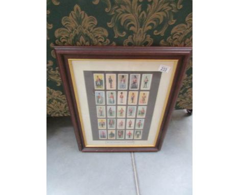 A framed and glazed set of British uniforms of the 19th century cigarette cards