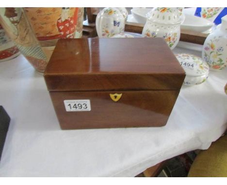 A Victorian mahogany tea caddy