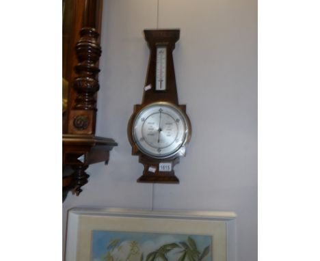 An oak art deco barometer
