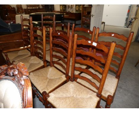 A set of 8 ladder back chairs