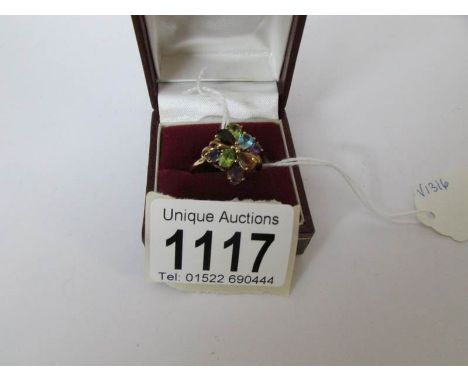 A gemstone ring set with peridot, amethyst, citrine, garnet etc, size R